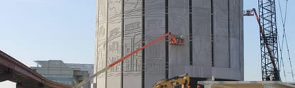 a team of workers on a precast concrete construction site 