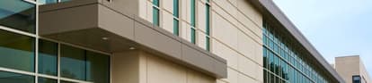 precast building with tan and brown walls and windows